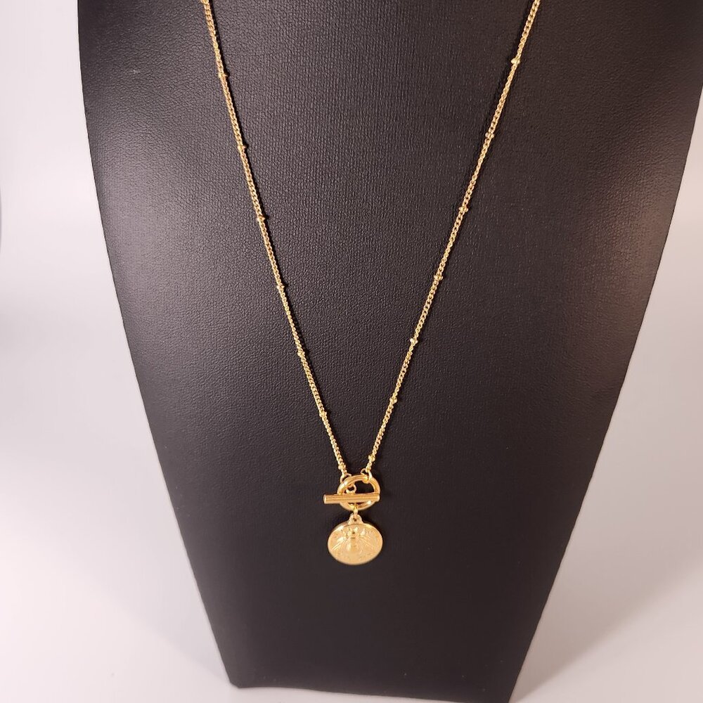 Gold plated 18" necklace with bee coin and toggle